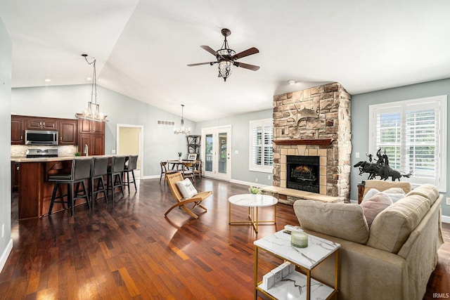 53 Ems C29 Ln, Warsaw, IN 46582 - living room with a ceiling fan, lofted ceiling, a fireplace, a chandelier, and dark wood-style floors
