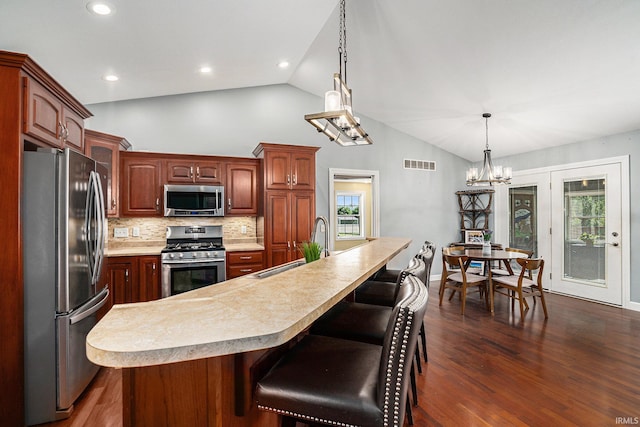 53 Ems C29 Ln, Warsaw, IN 46582 - kitchen featuring appliances with stainless steel finishes, a sink, light countertops, a chandelier, and dark wood-style floors