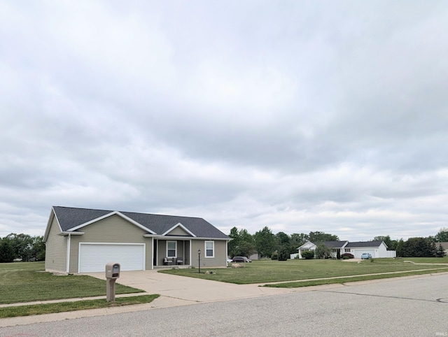 ranch-style house with concrete driveway, a garage, and a front lawn