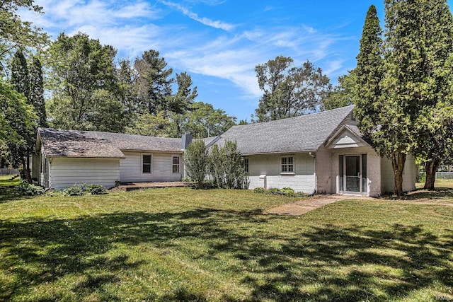 19401 Burke St, South Bend, IN 46637 - rear view of property featuring a yard