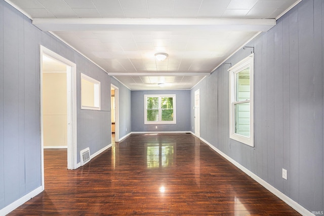 19401 Burke St, South Bend, IN 46637 - empty room featuring wood finished floors, crown molding, wooden walls, and baseboards