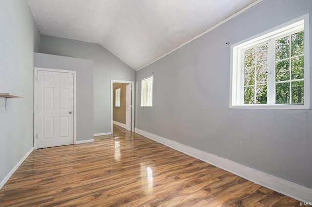 19401 Burke St, South Bend, IN 46637 - unfurnished bedroom featuring baseboards, wood finished floors, and vaulted ceiling