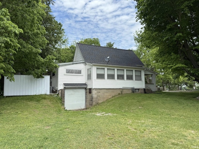 504 N Myra St, Worthington, IN 47471 - rear view of property featuring a lawn and roof with shingles