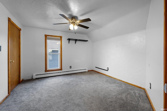 217 S Hamsher St, Garrett, IN 46738 - bonus room with a baseboard heating unit, carpet flooring, ceiling fan, lofted ceiling, and a textured ceiling