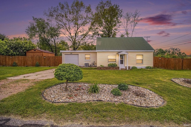 1652 N Sheridan St, South Bend, IN 46628 - view of front of house with an attached garage, metal roof, and central AC unit