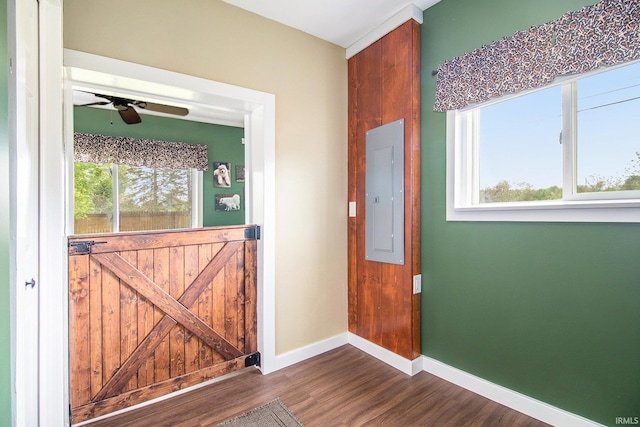 1652 N Sheridan St, South Bend, IN 46628 - foyer entrance with electric panel, baseboards, ceiling fan, and dark wood-type flooring