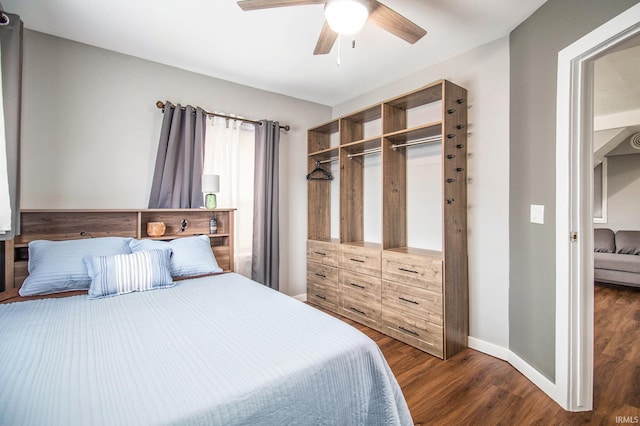 1652 N Sheridan St, South Bend, IN 46628 - bedroom featuring dark wood-style floors, baseboards, ceiling fan, and a closet
