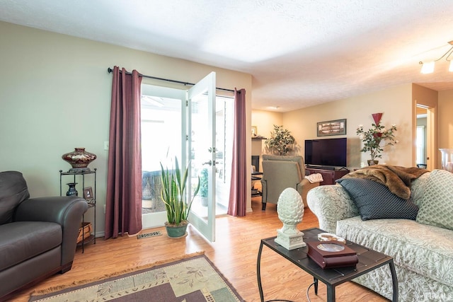 682 E Heather Dr, Bloomington, IN 47401 - living area featuring light wood-style floors and baseboards