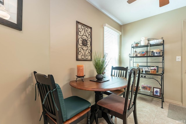 682 E Heather Dr, Bloomington, IN 47401 - dining space with ceiling fan, tile patterned floors, and baseboards