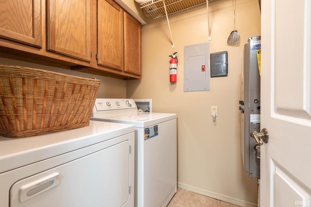 682 E Heather Dr, Bloomington, IN 47401 - washroom featuring washing machine and clothes dryer, electric panel, cabinet space, baseboards, and light tile patterned flooring