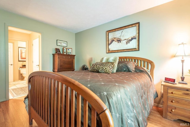 682 E Heather Dr, Bloomington, IN 47401 - bedroom with wood finished floors and ensuite bath