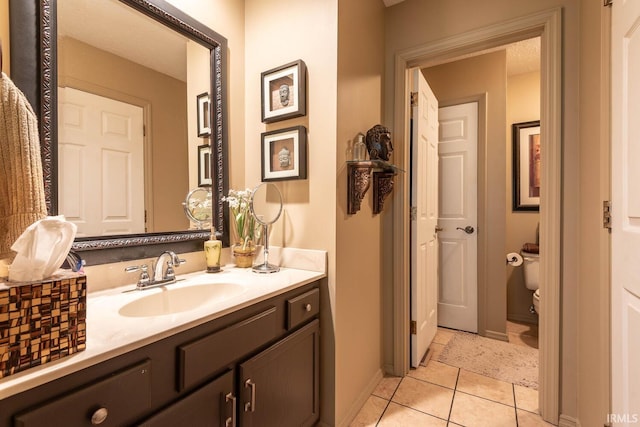 682 E Heather Dr, Bloomington, IN 47401 - bathroom with tile patterned floors, vanity, and toilet