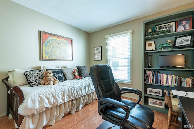 682 E Heather Dr, Bloomington, IN 47401 - bedroom featuring wood finished floors, baseboards, and an office area