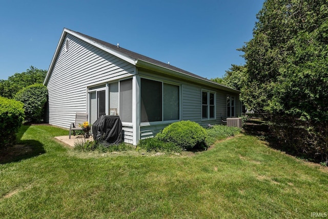 682 E Heather Dr, Bloomington, IN 47401 - back of property with a yard and central air condition unit