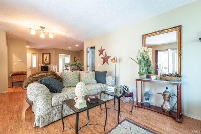 682 E Heather Dr, Bloomington, IN 47401 - living room featuring wood finished floors and baseboards