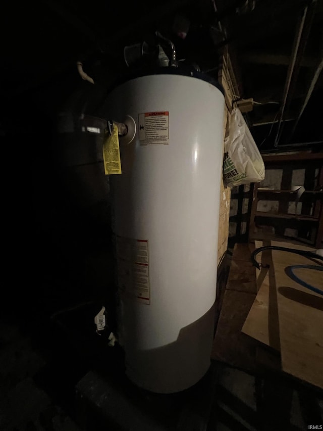 utility room featuring water heater