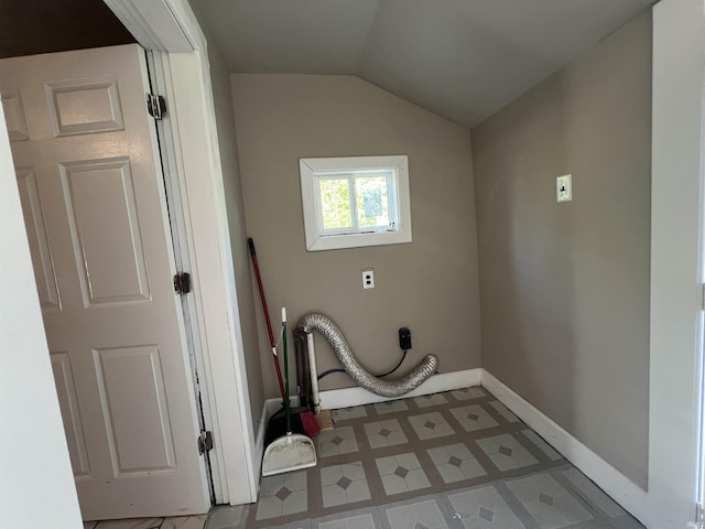 laundry area featuring baseboards and electric dryer hookup
