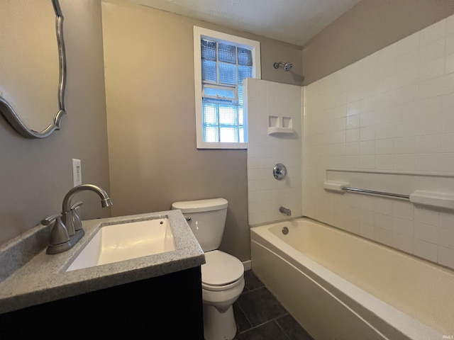 full bathroom featuring tile patterned flooring, toilet, vanity, and washtub / shower combination