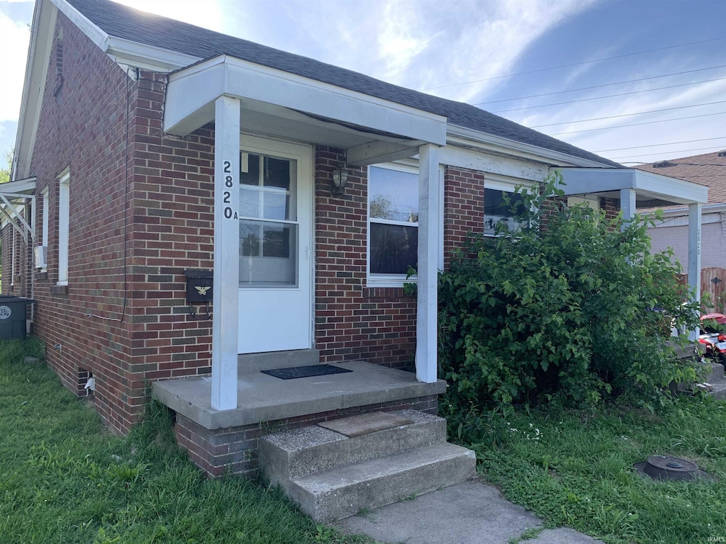 2820 Stringtown Rd, Evansville, IN 47711 - view of exterior entry featuring brick siding