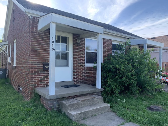 2820 Stringtown Rd, Evansville, IN 47711 - view of exterior entry featuring brick siding