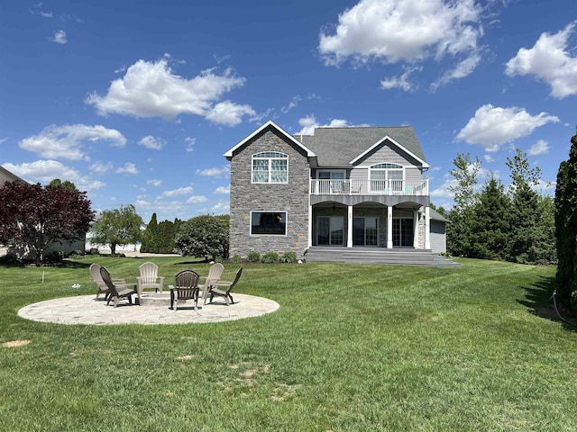 1620 Colonial Dr, Rochester, IN 46975 - rear view of property with stone siding, a balcony, a patio area, and a lawn