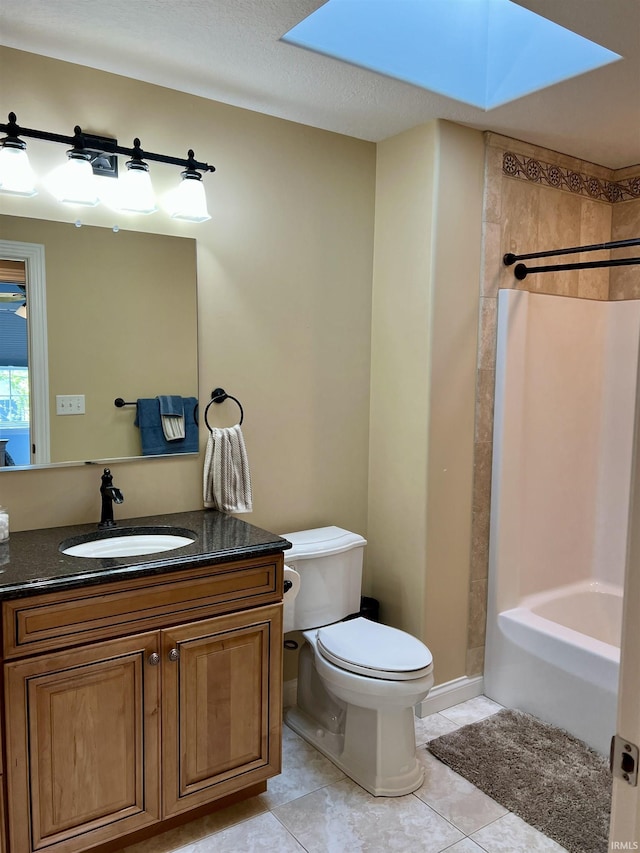 1620 Colonial Dr, Rochester, IN 46975 - full bath featuring a skylight, toilet, vanity, tile patterned flooring, and shower / bath combination