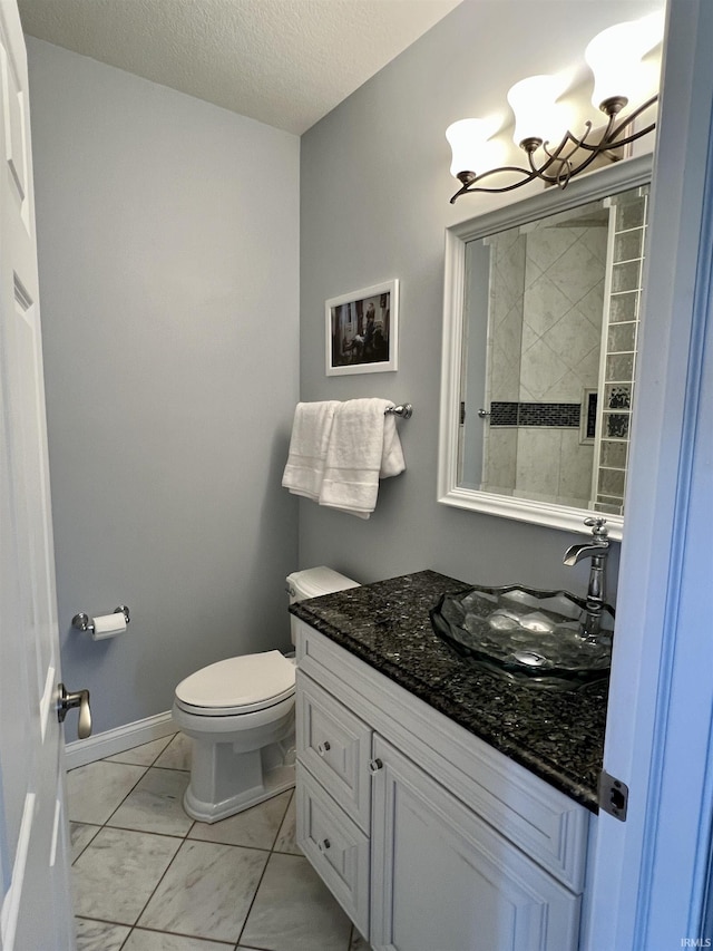 1620 Colonial Dr, Rochester, IN 46975 - bathroom featuring marble look tiles, vanity, toilet, a chandelier, and tiled shower