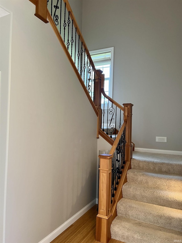 1620 Colonial Dr, Rochester, IN 46975 - stairway featuring baseboards and wood finished floors