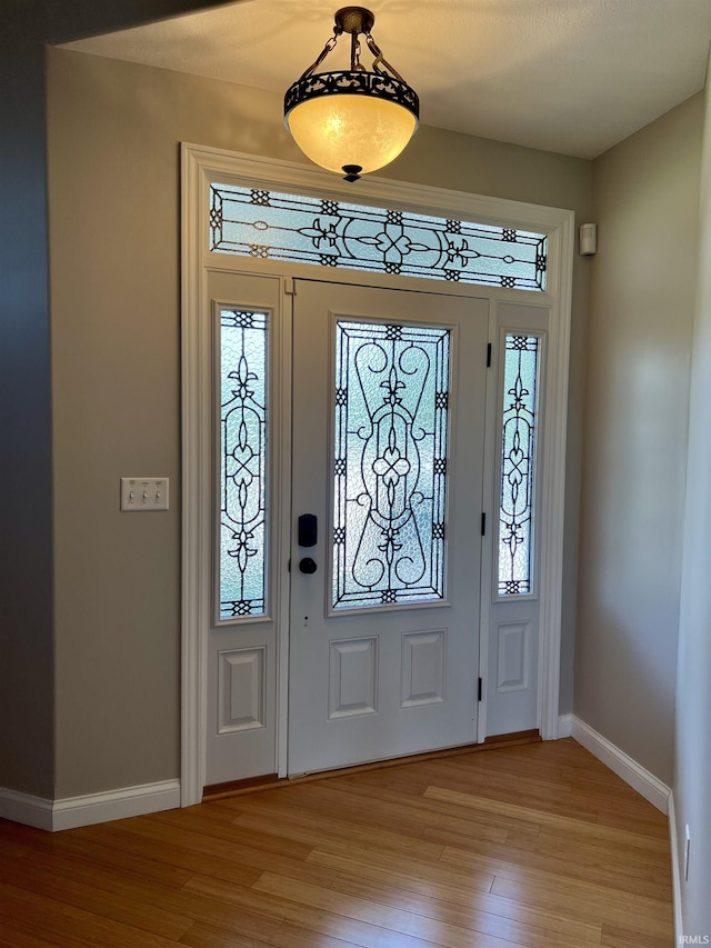 1620 Colonial Dr, Rochester, IN 46975 - entrance foyer with light wood-style floors and baseboards
