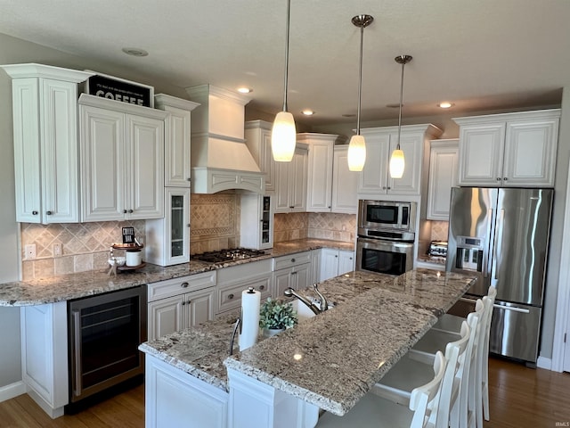 1620 Colonial Dr, Rochester, IN 46975 - kitchen with stainless steel appliances, wine cooler, white cabinets, dark wood-style floors, and recessed lighting