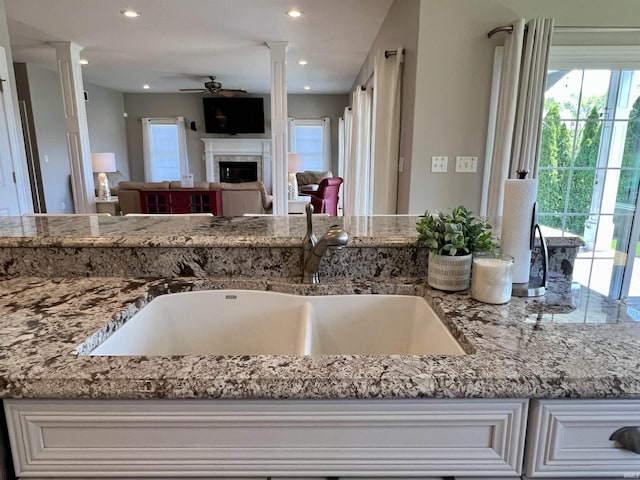 1620 Colonial Dr, Rochester, IN 46975 - kitchen featuring ceiling fan, a sink, decorative columns, plenty of natural light, and recessed lighting