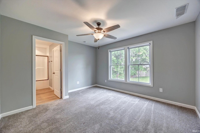 7215 W Mustang Dr, Ellettsville, IN 47429 - carpeted spare room with baseboards and ceiling fan