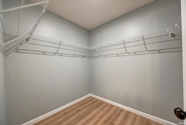 7215 W Mustang Dr, Ellettsville, IN 47429 - spacious closet featuring wood finished floors