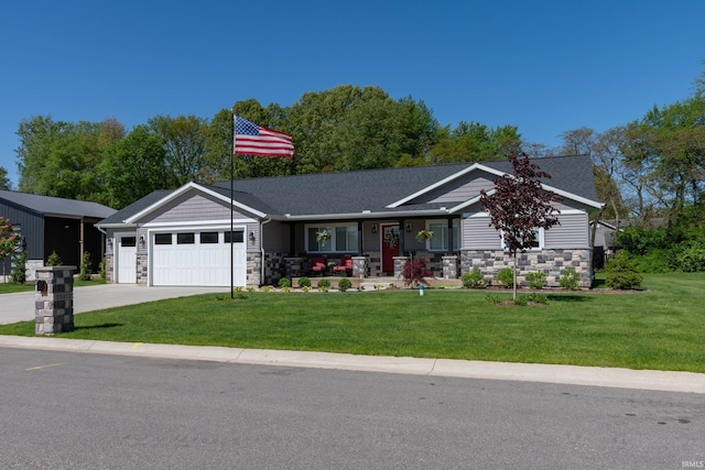 30512 Jaxon Dr, Elkhart, IN 46517 - view of front of house featuring stone siding, an attached garage, a porch, concrete driveway, and a front yard