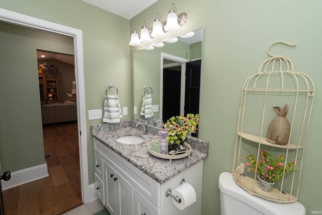30512 Jaxon Dr, Elkhart, IN 46517 - bathroom featuring wood finished floors, vanity, and toilet