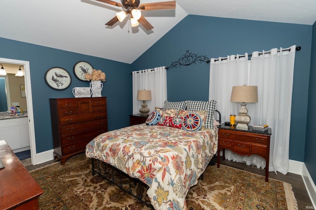 30512 Jaxon Dr, Elkhart, IN 46517 - bedroom with vaulted ceiling, baseboards, ceiling fan, ensuite bath, and wood finished floors