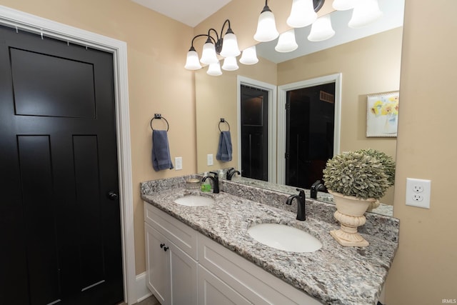 30512 Jaxon Dr, Elkhart, IN 46517 - full bath with double vanity and a chandelier