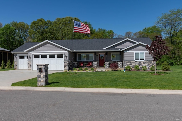 30512 Jaxon Dr, Elkhart, IN 46517 - view of front of house featuring stone siding, an attached garage, driveway, and a front lawn