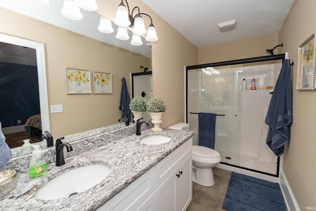 30512 Jaxon Dr, Elkhart, IN 46517 - bathroom with a stall shower, toilet, and double vanity