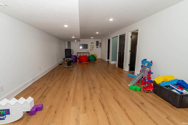 30512 Jaxon Dr, Elkhart, IN 46517 - playroom with light wood-style floors, recessed lighting, and baseboards