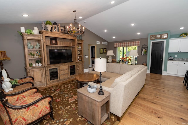 30512 Jaxon Dr, Elkhart, IN 46517 - living room with light wood-type flooring, vaulted ceiling, a chandelier, and recessed lighting