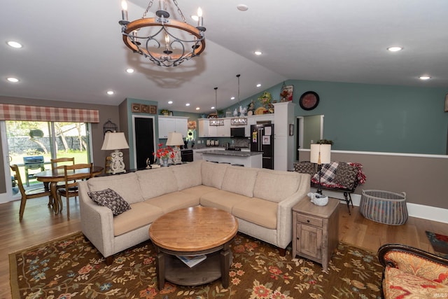 30512 Jaxon Dr, Elkhart, IN 46517 - living area with wood finished floors, vaulted ceiling, a chandelier, baseboards, and recessed lighting