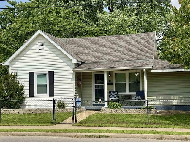 701 N Lincoln Ave, Rockport, IN 47635 - view of front facade featuring covered porch, roof with shingles, and a gate