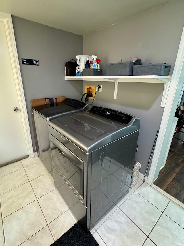 701 N Lincoln Ave, Rockport, IN 47635 - laundry area with washing machine and dryer and tile patterned flooring