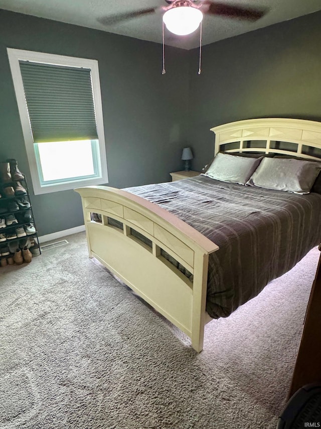 701 N Lincoln Ave, Rockport, IN 47635 - carpeted bedroom with baseboards and a ceiling fan