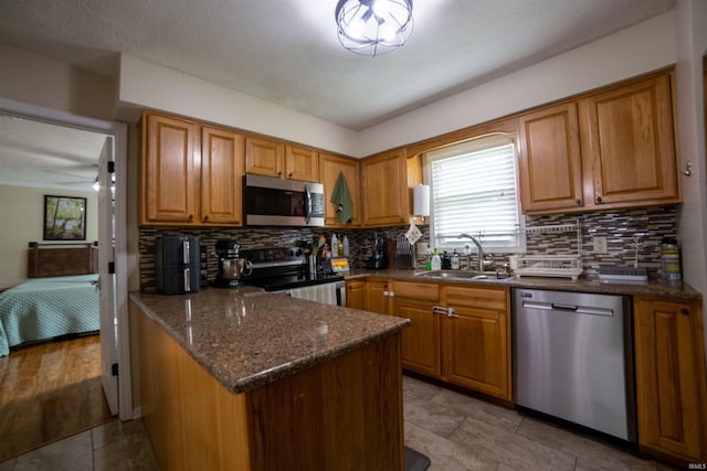 6330 Gardner Rd, Chandler, IN 47610 - kitchen featuring stainless steel appliances, a sink, plenty of natural light, and decorative backsplash