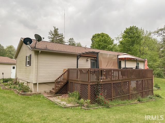 6330 Gardner Rd, Chandler, IN 47610 - rear view of property with a lawn and a wooden deck