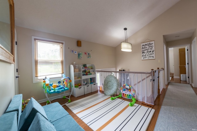 6330 Gardner Rd, Chandler, IN 47610 - playroom featuring wood finished floors and vaulted ceiling
