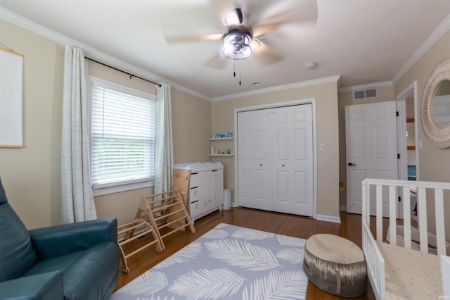 6330 Gardner Rd, Chandler, IN 47610 - bedroom featuring wood finished floors, a closet, crown molding, ceiling fan, and baseboards