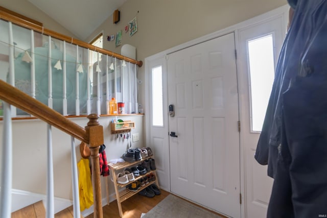 6330 Gardner Rd, Chandler, IN 47610 - foyer entrance with lofted ceiling, wood finished floors, and stairs
